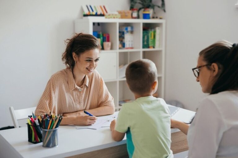 Child showing early speech delay signs during communication activities.